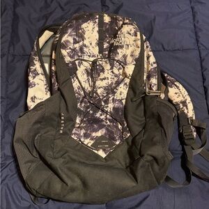 The North Face Black, Cream, and Purple Backpack